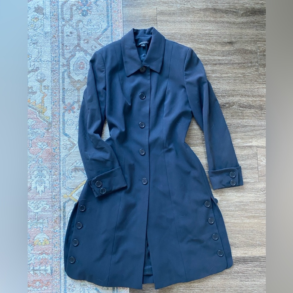 Long sleek coat with button details minimal and whimsical